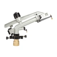 Brass steel rain gun sprinkler installed in agricultural irrigation field High pressure rain gun for large-scale crop irrigation systems Heavy-duty steel rain gun sprinkler watering farm crops Long-range agricultural sprinkler for commercial farm irrigation Brass irrigation rain gun with wide water coverage pattern Durable farm irrigation rain gun for plantation watering