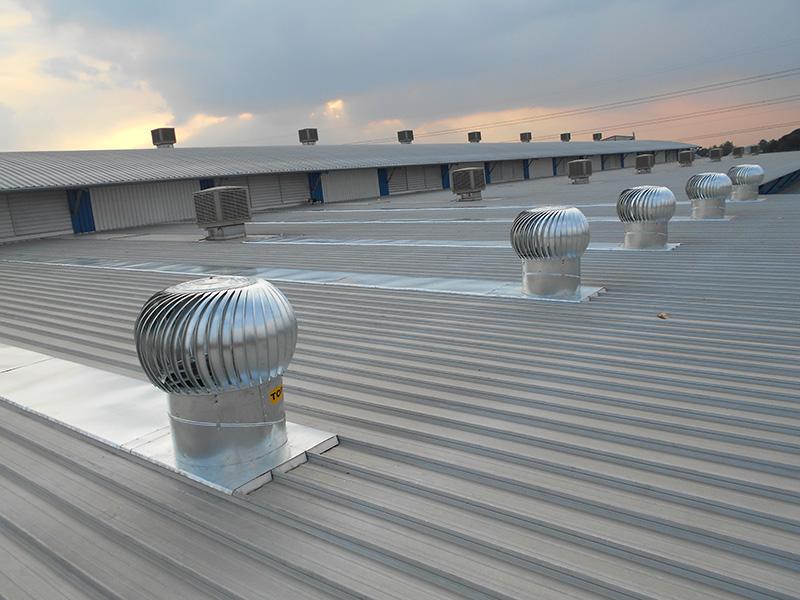 Industrial warehouse ventilation system installed in Kenya using large exhaust fans to improve indoor air quality.