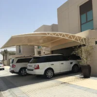 Double-bay wall-mounted car shade Wall-mounted carport Kenya Two-car shade net carport HDPE shade net car shed Steel wall-mounted car shelter Residential double carport Commercial parking canopy UV-treated shade net roofing Attached carport design Modern car shade installation